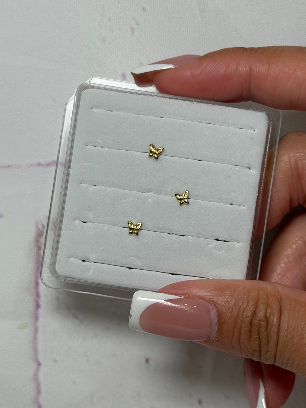 Goldie Butterfly Nose Piercing